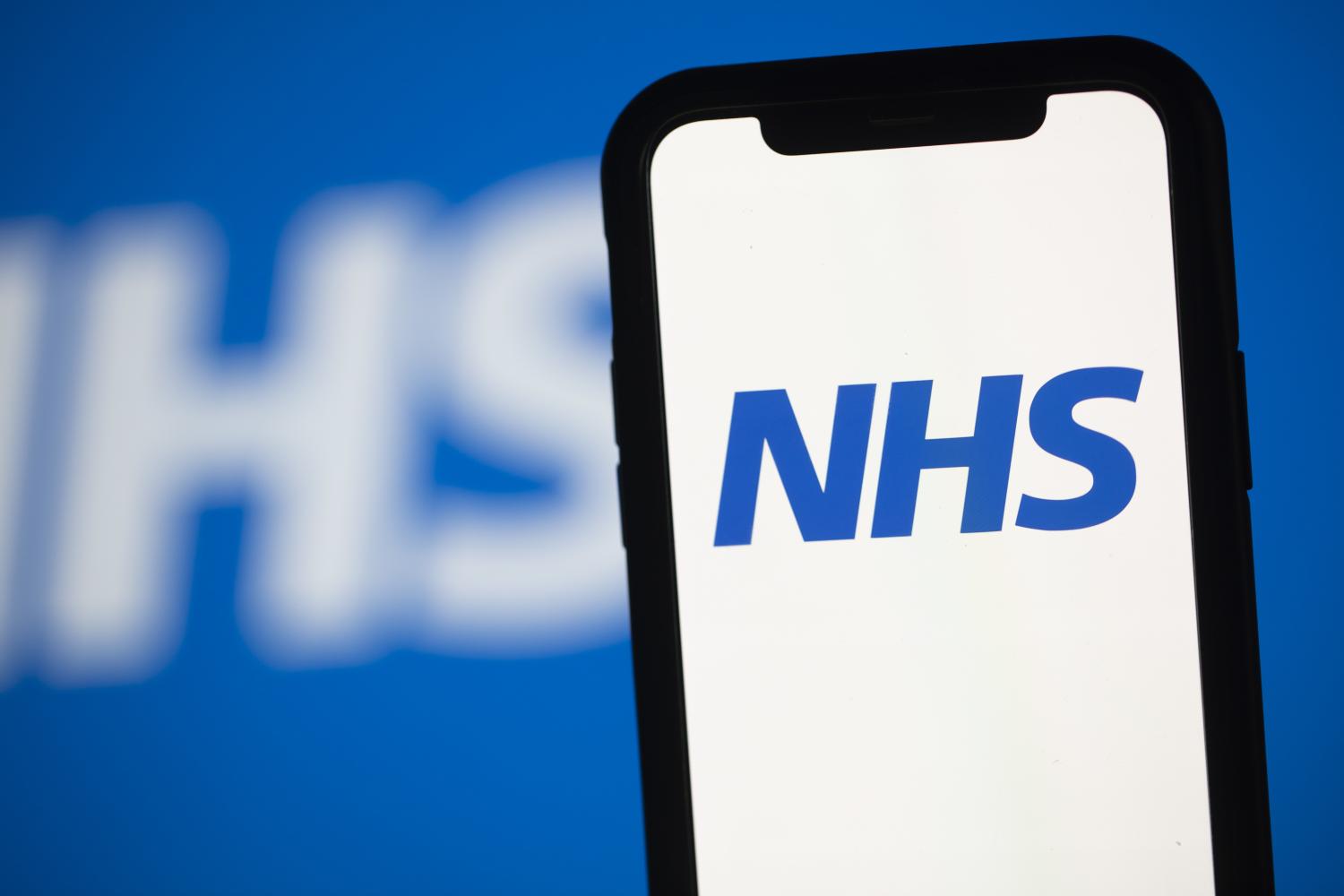 NHS logo displayed on a mobile phone screen